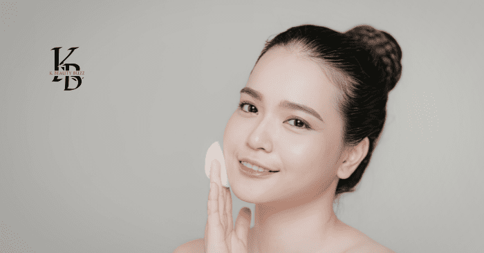 korean woman applying skincare with cotton pad for glowing healthy skin